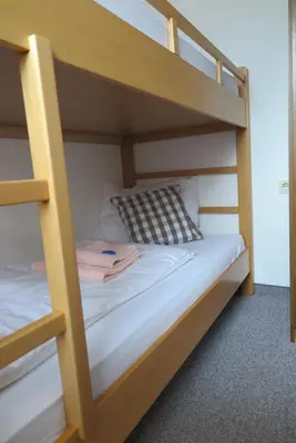 Ein Bett oder Betten in einem Zimmer der Unterkunft Haus Enzian