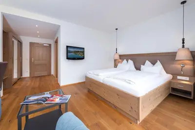 Ein Bett oder Betten in einem Zimmer der Unterkunft Hotel Stadler am Attersee