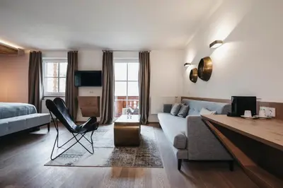 Ein Sitzbereich in der Unterkunft Sonnhof Alpendorf - an adults only place