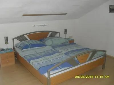 Ein Bett oder Betten in einem Zimmer der Unterkunft Ferienwohnung Stricker