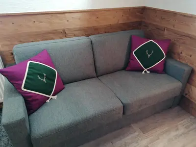 Ein Sitzbereich in der Unterkunft Greenheart Aussee