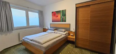 Ein Bett oder Betten in einem Zimmer der Unterkunft Maisonette Haus Amade
