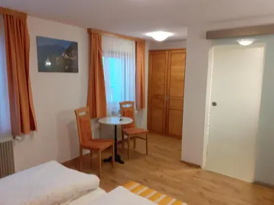 Ein Bett oder Betten in einem Zimmer der Unterkunft Pension Hirlatz