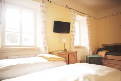Ein Bett oder Betten in einem Zimmer der Unterkunft Hotel-Gasthof Weitgasser
