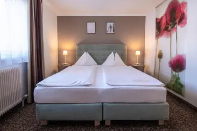 Ein Bett oder Betten in einem Zimmer der Unterkunft Hotel Pension Waldesruh