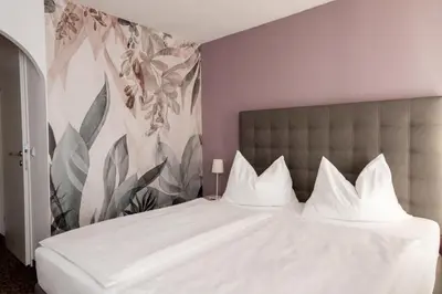 Ein Bett oder Betten in einem Zimmer der Unterkunft Hotel Pension Waldesruh