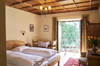 Ein Bett oder Betten in einem Zimmer der Unterkunft Hotel Post Mauterndorf OG