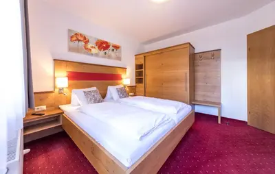 Ein Bett oder Betten in einem Zimmer der Unterkunft Landhaus Rosengartl