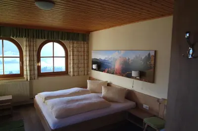 Ein Bett oder Betten in einem Zimmer der Unterkunft Gästehaus Davidbauer
