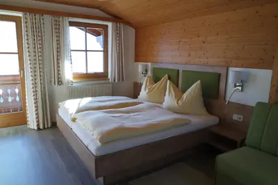Ein Bett oder Betten in einem Zimmer der Unterkunft Gästehaus Davidbauer