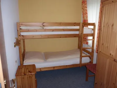 Ein Bett oder Betten in einem Zimmer der Unterkunft Pension ALPENHAUS