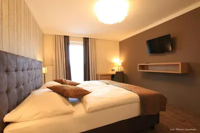 Ein Bett oder Betten in einem Zimmer der Unterkunft Gasthof Alpenblick