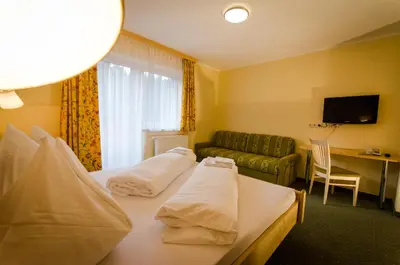 Ein Bett oder Betten in einem Zimmer der Unterkunft Alpengasthof Grimmingblick