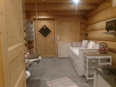 Ein Bett oder Betten in einem Zimmer der Unterkunft Ferienwohnungen Blockhaus - Zwergenhäusl Grünau im Almtal
