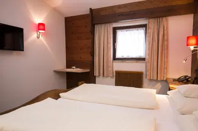 Ein Bett oder Betten in einem Zimmer der Unterkunft Hotel Altmünsterhof