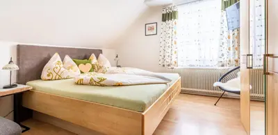Ein Bett oder Betten in einem Zimmer der Unterkunft Biobauernhof Tonimörtl
