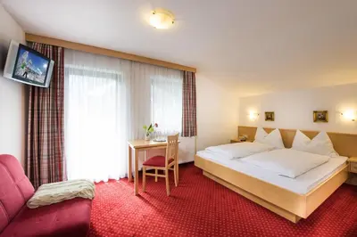 Ein Bett oder Betten in einem Zimmer der Unterkunft Pension Haus am Dorfplatz