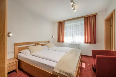 Ein Bett oder Betten in einem Zimmer der Unterkunft Appartements Salzburgerhof