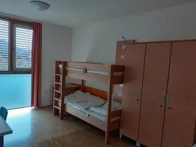 Ein Bett oder Betten in einem Zimmer der Unterkunft Jugendherberge Tamsweg