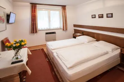 Ein Bett oder Betten in einem Zimmer der Unterkunft Gästehaus Sunkler