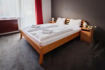 Ein Bett oder Betten in einem Zimmer der Unterkunft Pension Tilly