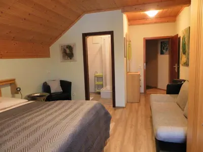 Ein Sitzbereich in der Unterkunft Apartment zum Wasserfall