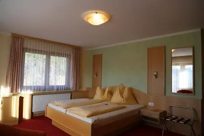 Ein Bett oder Betten in einem Zimmer der Unterkunft Timmelbauerhof
