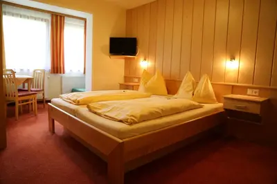Ein Bett oder Betten in einem Zimmer der Unterkunft Timmelbauerhof