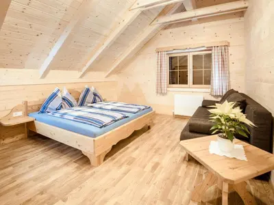 Ein Bett oder Betten in einem Zimmer der Unterkunft Chalet Grimmingblickhütte by Interhome