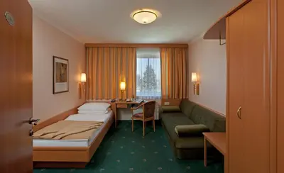 Ein Bett oder Betten in einem Zimmer der Unterkunft Hotel Hallerhof