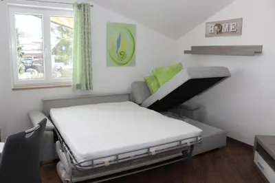 Ein Bett oder Betten in einem Zimmer der Unterkunft Ferienwohnung Lindpointner
