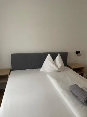 Ein Bett oder Betten in einem Zimmer der Unterkunft Haus Alpenland