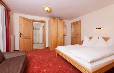 Ein Bett oder Betten in einem Zimmer der Unterkunft Apparthaus Taxegger