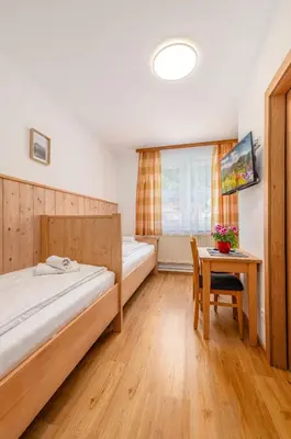 Ein Bett oder Betten in einem Zimmer der Unterkunft s'Wirtshaus by Alpine Genusswelten