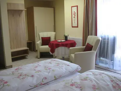 Ein Bett oder Betten in einem Zimmer der Unterkunft Pension Schlömmer