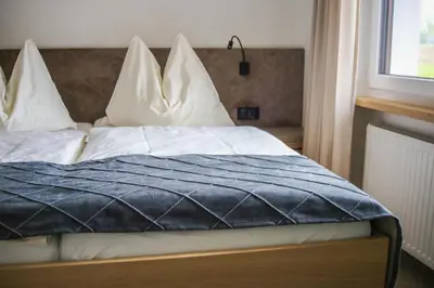 Ein Bett oder Betten in einem Zimmer der Unterkunft Pension Reiter-Moravec