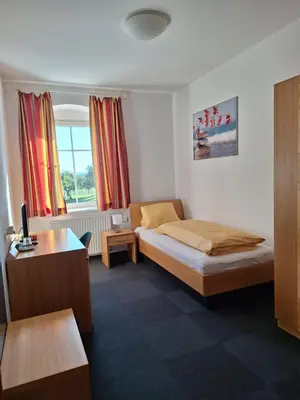 Ein Bett oder Betten in einem Zimmer der Unterkunft Gasthaus Kloibhofer