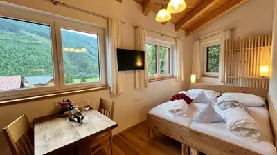 Ein Bett oder Betten in einem Zimmer der Unterkunft Montanara Apartment & Zimmer
