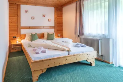 Ein Bett oder Betten in einem Zimmer der Unterkunft Panoramahotel Stocker