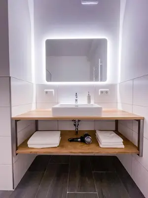 Ein Badezimmer in der Unterkunft Glüxplatzl GmbH Appartements am Wald