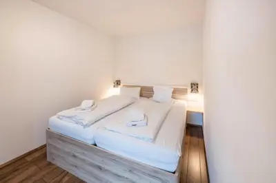 Ein Bett oder Betten in einem Zimmer der Unterkunft Mentenwirt Pension&Appartements