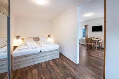 Ein Bett oder Betten in einem Zimmer der Unterkunft Mentenwirt Pension&Appartements