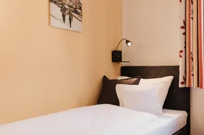 Ein Bett oder Betten in einem Zimmer der Unterkunft Alte Schmiede - das kleine Hotel