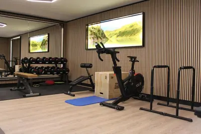 Das Fitnesscenter und/oder die Fitnesseinrichtungen in der Unterkunft Apartment Panorama
