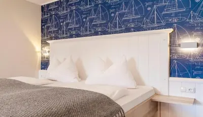 Ein Bett oder Betten in einem Zimmer der Unterkunft Arndt's Bootshaus