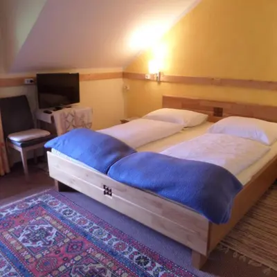 Ein Bett oder Betten in einem Zimmer der Unterkunft Kalcherhof