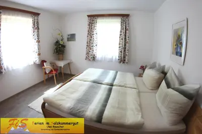 Ein Bett oder Betten in einem Zimmer der Unterkunft Haus Seeruhe - direkt am Grundlsee