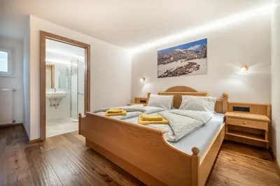 Ein Bett oder Betten in einem Zimmer der Unterkunft Rickys Apartment Flachau