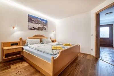 Ein Bett oder Betten in einem Zimmer der Unterkunft Rickys Apartment Flachau