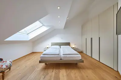 Ein Bett oder Betten in einem Zimmer der Unterkunft Ferienwohnung Grimmingblick
